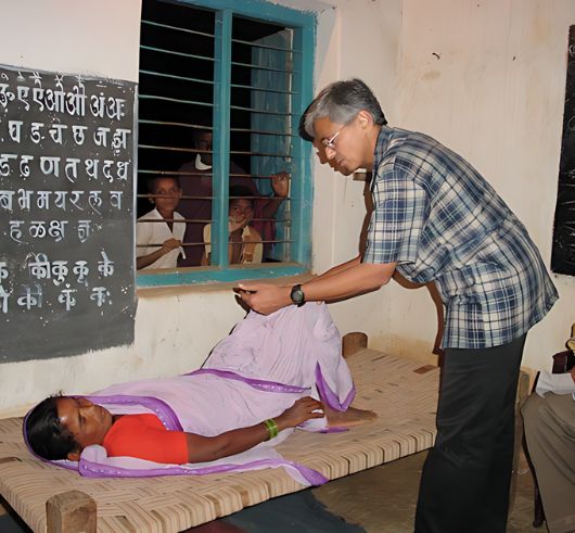 Doctors conducting spine health checkups at a rural healthcare camp organized by The Spine Foundation